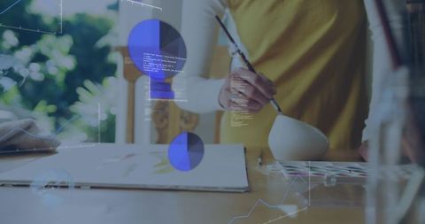 Artist painting watercolor in studio with augmented data overlays and daylight greenery
