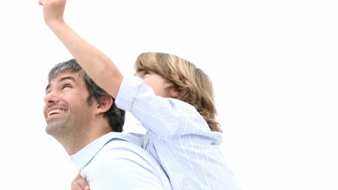 Father Giving Son a Joyful Piggyback Ride