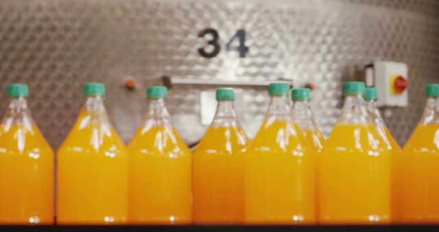 Fresh Orange Juice Bottles in Factory Setting - Download Free Stock Images Pikwizard.com