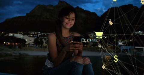 Woman Exploring Smartphone Technology Outdoors at Night
