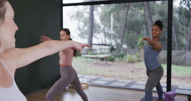 Women Practicing Yoga in Studio with Forest View - Download Free Stock Images Pikwizard.com