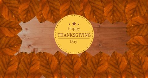 Thanksgiving Greeting with Autumn Leaves on Wood Background