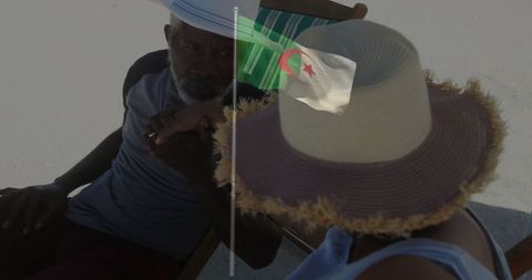 Father and Daughter Bonding on Beach Vacation with Algerian Flag