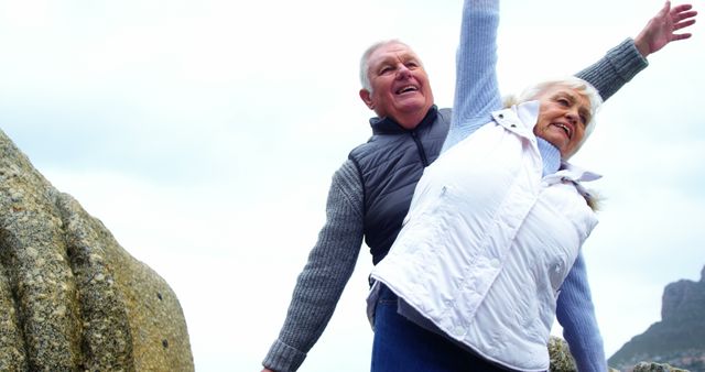 A senior Caucasian couple celebrates joyfully outdoors, with copy space - Download Free Stock Photos Pikwizard.com