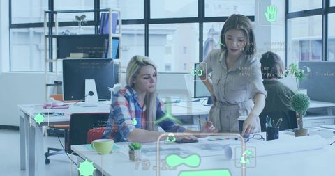 Colleagues Discussing Eco-Friendly Innovations in Office