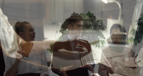 Diverse Business Team Collaborating Overlaid with Technology