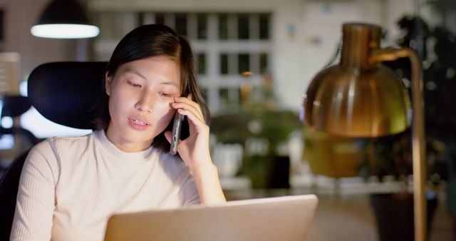 Businesswoman Working Late in Office Talking on Phone - Download Free Stock Images Pikwizard.com