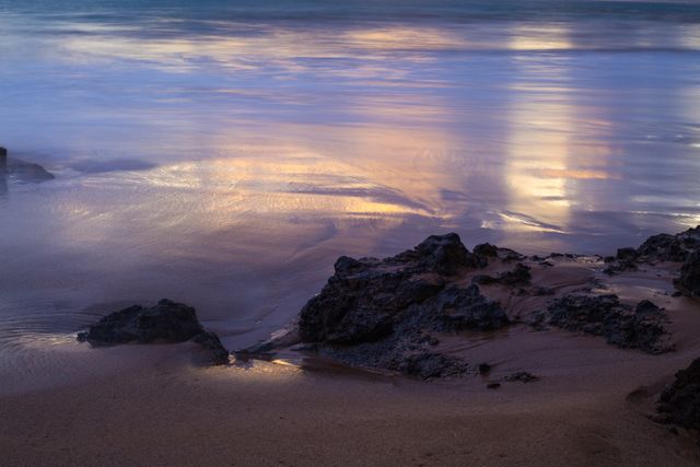 Serene Sunset Reflecting on Rocky Seashore - Download Free Stock Photos Pikwizard.com