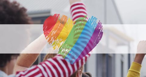 Diverse protesters with rainbow heart celebrating lgbt rights