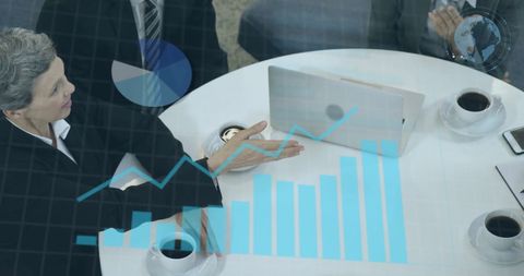 Diverse Business Team Analyzing Financial Data in Office Setting