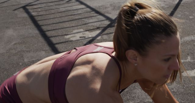 Focused Woman in Activewear Preparing for Outdoor Workout - Download Free Stock Images Pikwizard.com