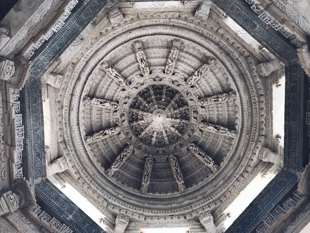 This image shows the detailed and intricate carvings on the dome ceiling of an ancient architectural structure. The ornate designs and sculptures reflect cultural heritage and artistic value, suitable for use in articles, blogs, or educational materials about history, culture, art, or architecture.