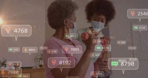 Caregiver assisting senior woman lifting dumbbell at home with floating health alerts