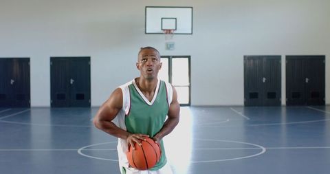 Basketball Player Focusing During Indoor Training Session - Download Free Stock Images Pikwizard.com