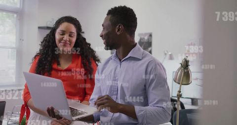 Diverse Professionals Collaborating in Modern Office with Digital Interface