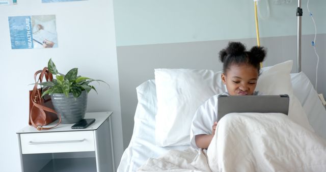 Young Patient Using Tablet in Hospital Bed - Download Free Stock Images Pikwizard.com