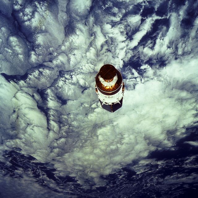 Tracking and Data Relay Satellite hovering in Earth's orbit during STS-43 mission. Satellite providing near uninterrupted communication with Earth-orbiting space shuttles and satellites. Useful for educational material, space exploration articles, aerospace presentations.
