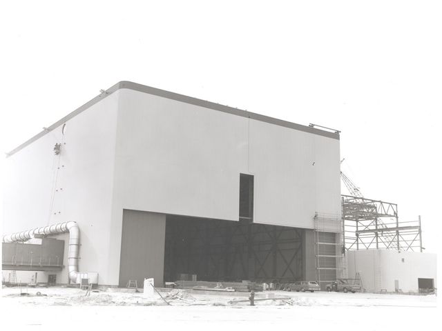 View of OPF High Bay No. 1 and Low Bay construction, 1976