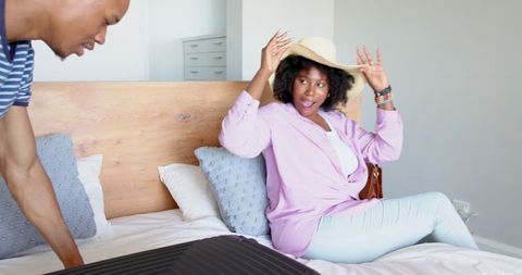 Couple Packing for a Vacation Getaway at Home