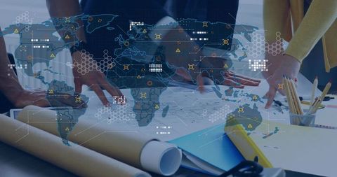 Global infrastructure planning team collaborating over blueprints with digital map overlay