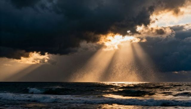 Sunbeams Piercing Storm Clouds Over Ocean at Golden Hour with Dramatic Crepuscular Rays