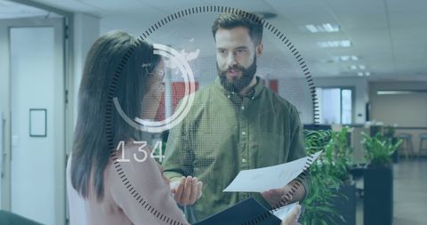 Business Professionals Analyzing Digital Data Projections in Modern Office