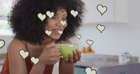 Woman enjoying coffee with heart icons around