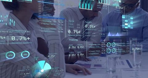 Executive team analyzing financial dashboards with augmented data overlays for planning