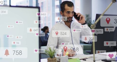 Focused Businessman Engaging with Digital Notifications in Office