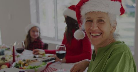 Joyful Grandmother Enjoying Festive Christmas Dinner