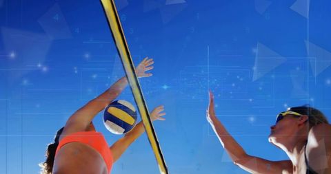 Dynamic volleyball match at sunny beach with intense action