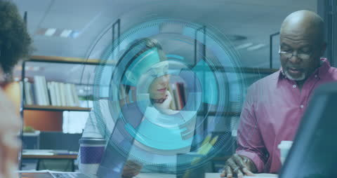 Multicultural Team Engaged in High-Tech Business Discussion