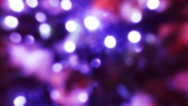 Colorful spots of light against purple background, background with abstract texture concept