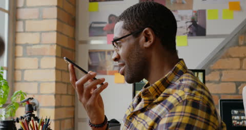 Young Professional Engaging in Remote Communication at Workspace