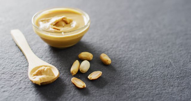 Creamy Peanut Butter and Peanuts on Dark Background - Download Free Stock Images Pikwizard.com