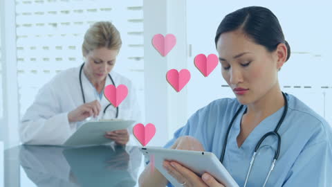 Diverse Female Doctors Using Technology with Heart Overlay