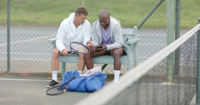 Two Diverse Tennis Players Discussing On Court During Break - Download Free Stock Images Pikwizard.com