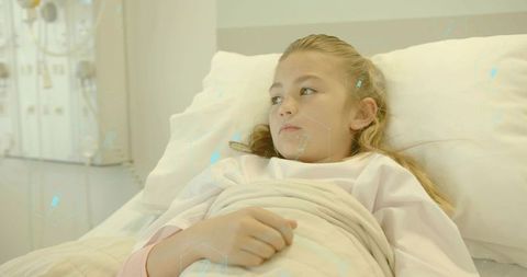 Young girl resting in hospital bed with digital monitoring overlay for pediatric care