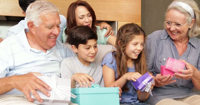 Happy Family Opening Gifts Together at Home - Download Free Stock Images Pikwizard.com