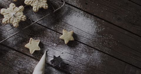Festive Holiday Cookies with Confectioner's Sugar on Rustic Table - Download Free Stock Images Pikwizard.com