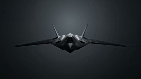 Stealth bomber in dramatic hangar lighting