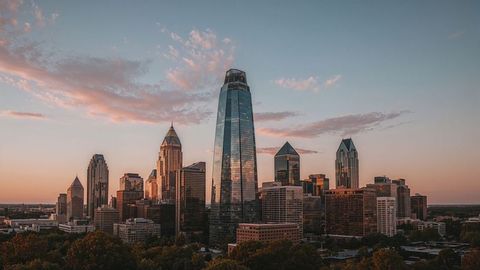 Sunset reflections on charlotte downtown glass skyscraper