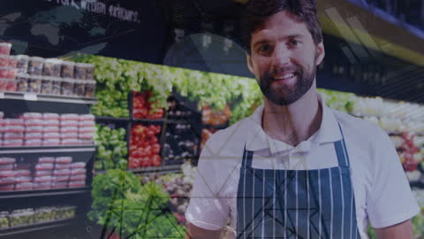 Smiling Greengrocer Standing in Store with Fresh Produce