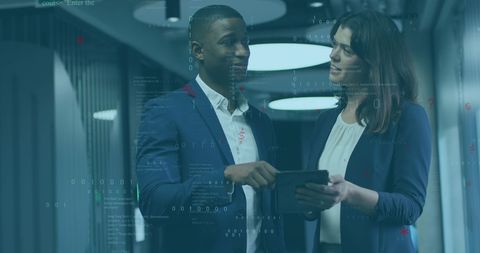 business professionals analyzing data on tablet in corporate office - Download Free Stock Images Pikwizard.com