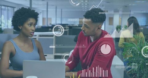 Young professionals discussing data analytics at modern open office with dashboard overlay