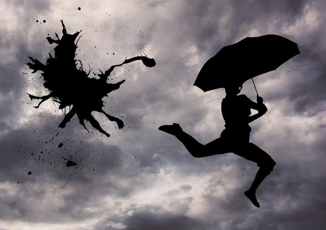 This image shows a person silhouetted against a stormy sky while jumping with an umbrella. An artistic ink splash adds a surreal element. Suitable for use in creative projects, promotional materials, and designs related to weather, artistry, creativity, or stormy conditions.