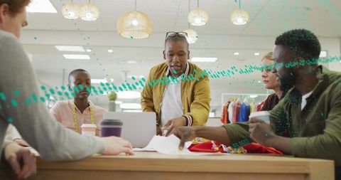 Diverse Team Analyzing Global Market Data in Office