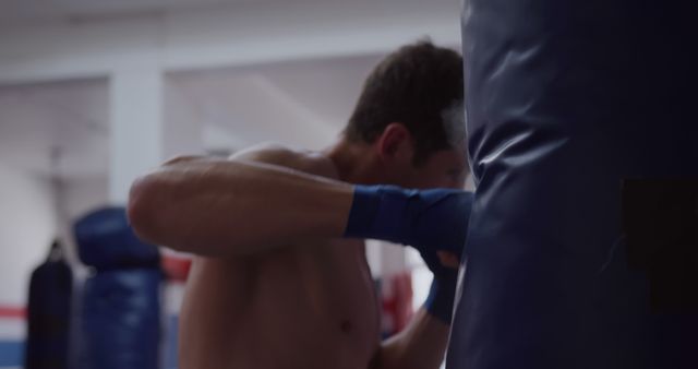 Man Boxer Punching Heavy Bag in Gym - Download Free Stock Images Pikwizard.com