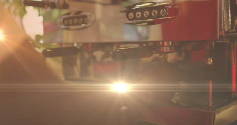 Barista Skillfully Operating Espresso Machine with Artistic Lighting