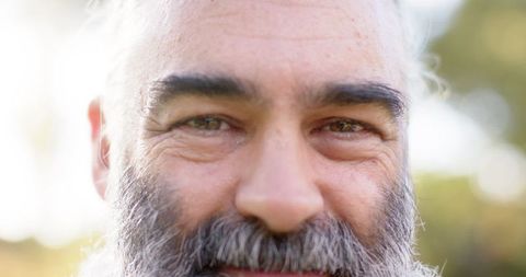 Bearded Senior Man Enjoying Outdoor Leisure and Friendship